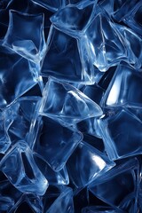 Pile of ice cubes arranged in abstract shape against pure blue background, artistic frozen water composition with modern design aesthetic.