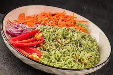 vegetarian noodles jade noodles with vegetables green noodles healthy food budha bowl main course appetizer fresh delicious gourmet food table background rustic food top view copy space