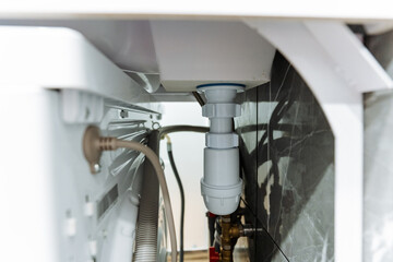 easily accessible sink plumbing connections, all piping under sink is fully visible and reachable, transparent cabinet design reveals all plumbing and connection points underneath sink with ease