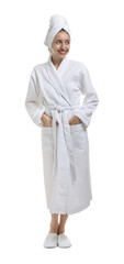 Beautiful woman wearing bathrobe with hair wrapped in towel on white background