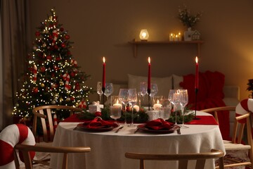 Festive table setting with Christmas decor indoors