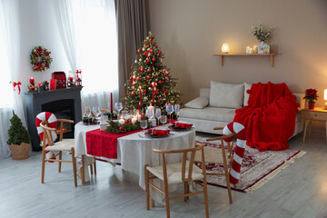 Festive table setting with Christmas decor indoors