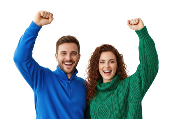 young caucasian couple in blue fleece and green cable-knit sweater raising clenched fists in ecstatic, triumphant pose against a high-key white studio background. concept of shared success and