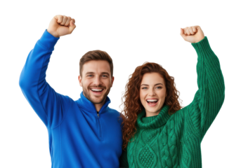 young caucasian couple in blue fleece and green cable-knit sweater raising clenched fists in ecstatic, triumphant pose against a high-key white studio background. concept of shared success and