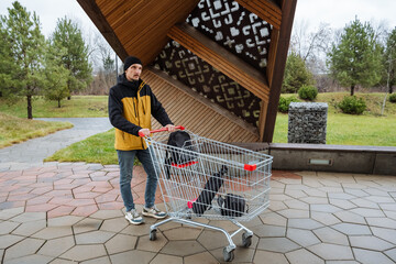 urban parenting errand, parenting in city park with stroller, casual outdoor moment of father running errands, an everyday scene of father taking care of shopping and his child