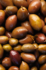 Delicious olives with stones,  macro.  Olive fruit background