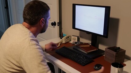 Middle Aged System Administrator Get Late Night Call to Restore Network After Ransomware Cyber Attack - Systems Engineer Restore Backups and Saves Day