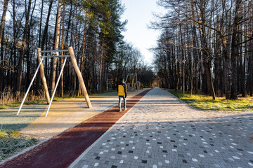 urban winter stroll, gentle city park winter excursion, quiet urban outdoor walk amidst winter surroundings, peaceful city park exploration during cold winter afternoon hours