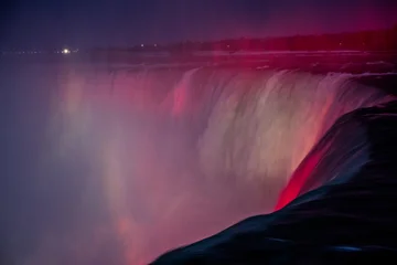 Fotobehang Crimson Colorful night illumination over Horseshoe Falls at Niagara Falls  © Emad Aljumah