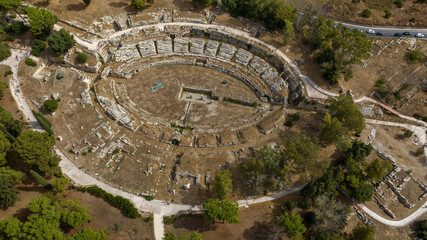 Aerial view of the Greek amphitheater in Syracuse, Sicily, Italy. These are the ruins of an ancient amphitheater located within the Neapolis Archaeological Park. An ancient polis and Greek colony.