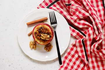 Baked apples with oatmeal, walnuts, raisins, honey and cinnamon