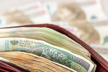 Poland money. Wallet full of money. Polish finances. Business background, economic concept. Savings, expense analysis, investments, housing loan, stock market. close up