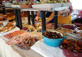 A festive Christmas buffet served on a small boat.