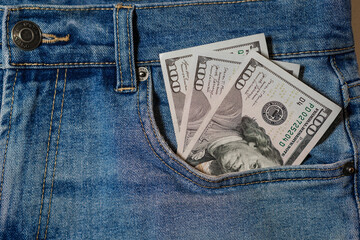 Cash Tucked Into a Pocket of Blue Denim Jeans Suggesting Savings and Financial Management