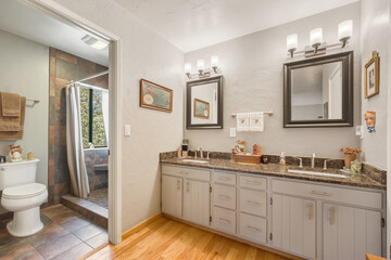 Elegant Bathroom Features, Roomy Bathroom Showcases Granite Surfaces And Inviting Illumination For Comfort