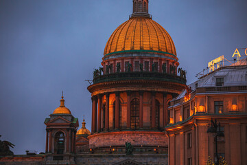 Fototapeta premium St. Isaac's Cathedral and the Astoria Hotel on a winter evening. New Year and Christmas decoration of the city.