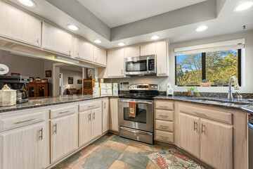 Contemporary Space With Outdoor View, Luxurious Kitchen Featuring Granite And Stainless Steel