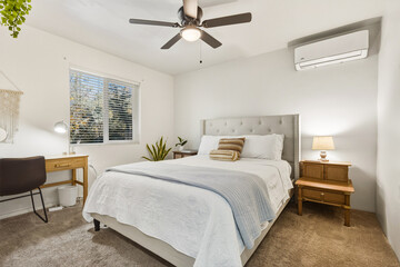 Fototapeta premium Sunny Room With Comfortable Furnishings, Luminous Bedroom Featuring Work Area And Relaxing Decor