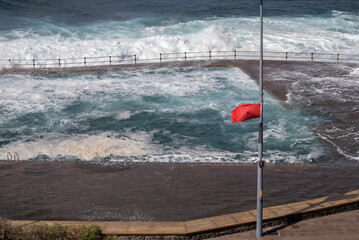 Red flag on the Atlantic ocean beach, Tenerife, Spain