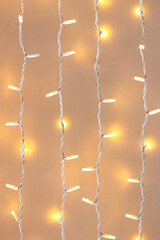 Festive LED string lights hanging on a light background