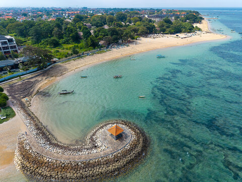 Fishing boats floating in clear turquoise water off Sanur beach, Bali - Powered by Adobe