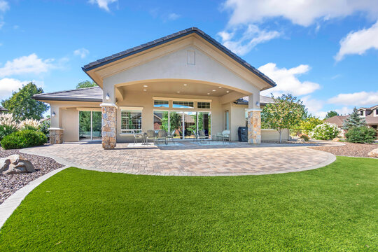 Contemporary Lowmaintenance Backyard Outdoor Space, Modern Backyard With Turf And Mountain Views