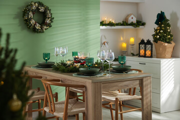 Festive table setting with Christmas decor indoors