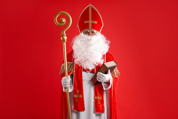 Saint Nicholas with book and crozier on red background