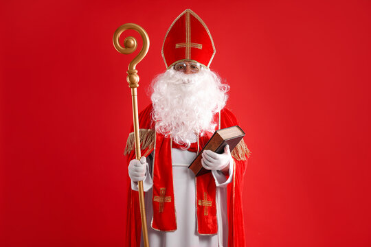 Saint Nicholas with book and crozier on red background