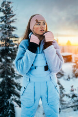 Beautiful caucasian women posing in winter sports clothing during sunset in Lapland