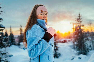 Beautiful caucasian women posing in winter sports clothing during sunset in Lapland