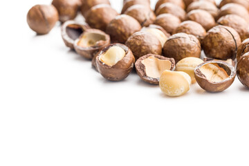 Tasty macadamia nuts isolated on white background.