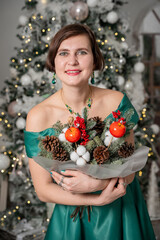 Woman Smiling While Holding Festive Holiday Bouquet