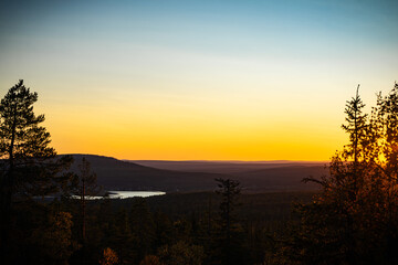 Magical Golden Hour View of a Lake from Yll&auml;s Fell Summit in Finnish Lapland during Autumn.