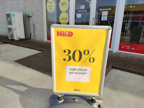 Rome, Italy - November 29, 2025: NKD store sign displaying 30% discount on already reduced items, inviting customers to take advantage of the sale outside the retail location