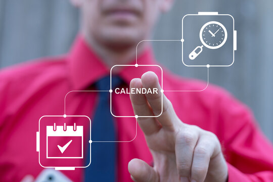 Business person using virtual touch screen presses the word CALENDAR. Business planning, scheduling, time management, organisation concept. Organizing work tasks, daily events, business meetings.