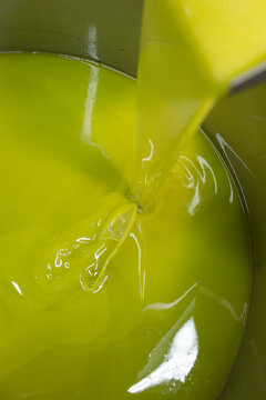 Golden Extra Virgin Olive Oil Pouring from a Traditional Press in a Local Mill