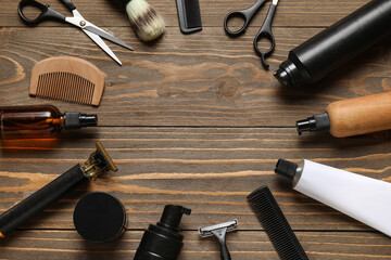 Frame made of male shaving accessories on wooden background