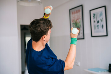 Slow motion lifting exercise for shoulder recovery in peaceful space
