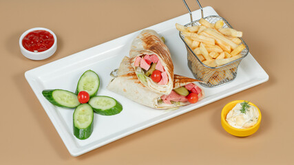 Sliced roll and fries basket on plate