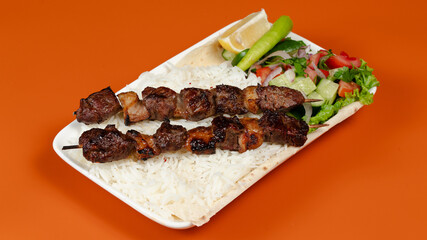 Delicious kebab plate isolated top view
