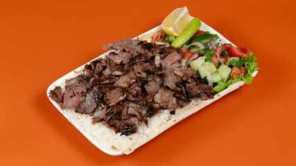 Delicious kebab plate isolated top view
