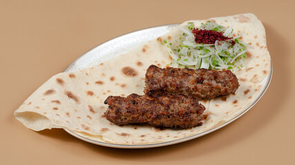 Delicious kebab plate isolated top view