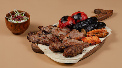 Delicious kebab plate isolated top view