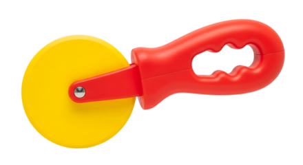Red and yellow plastic pizza cutter toy on black background kitchen utensil
