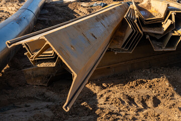 A close-up shot of several interlocking steel sheet piles