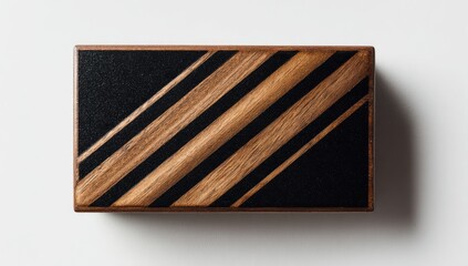 Wood box with black diagonal stripes on a white surface