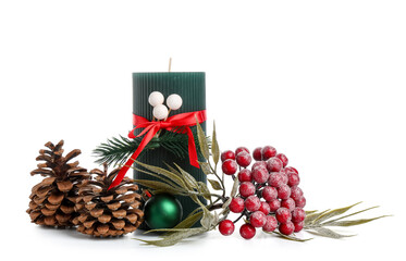 Beautiful Christmas green candle with decorative berries isolated on white background, closeup