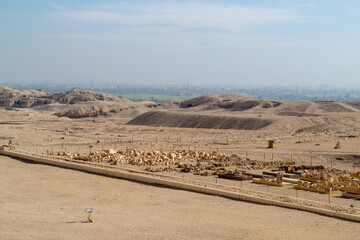 Egypt, Luxor, 01.02.2022 Ancient stone ruins with broken columns under harsh desert sunlight, warm earthy colors, historical archaeological theme