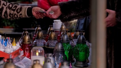 Glass Votive Candle Lanterns Sold at Outdoor Market Stand by Christian Catholic Cemetery on All Saint Day